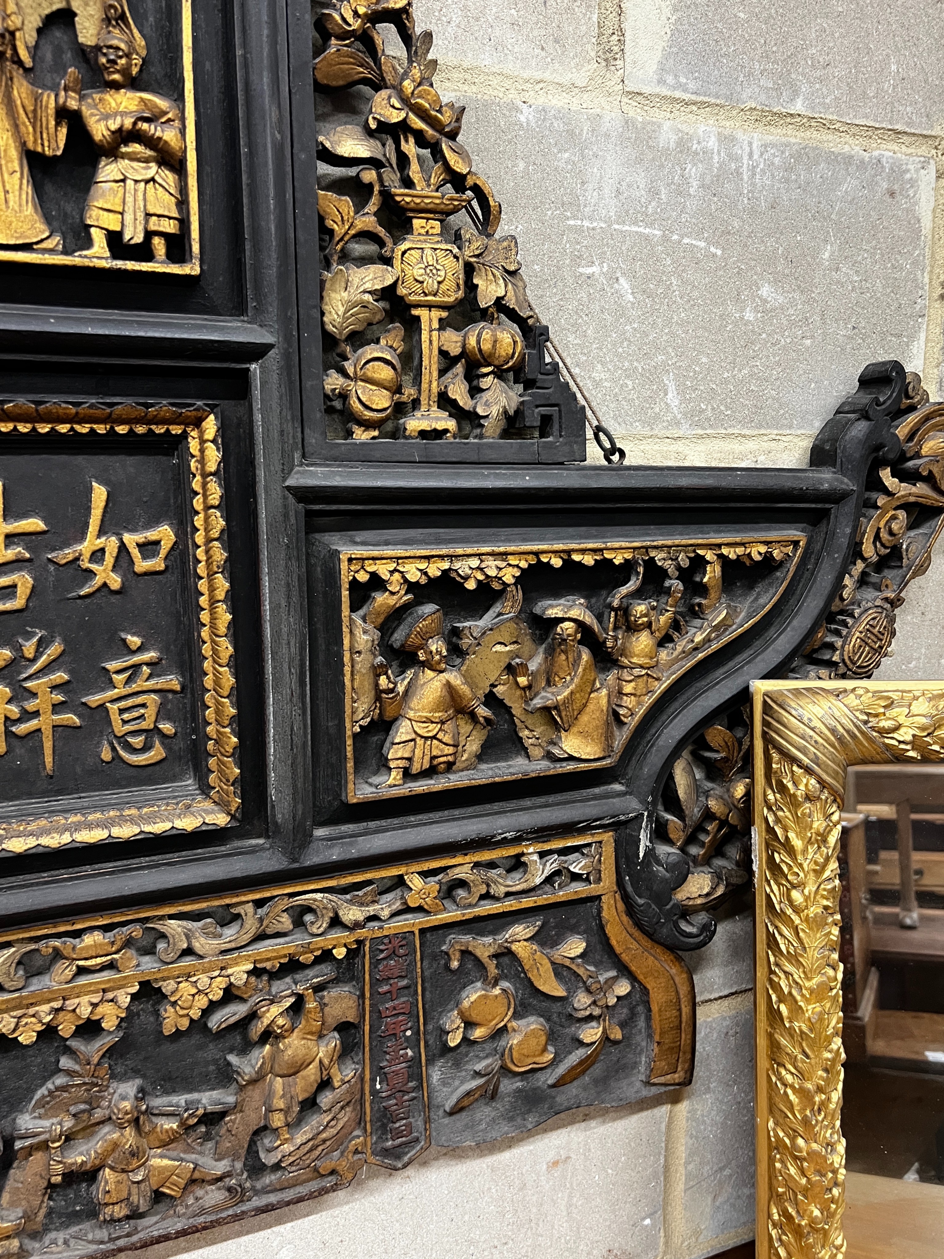 A Chinese carved parcel gilt lacquer wall plaque, width 140cm, height 107cm